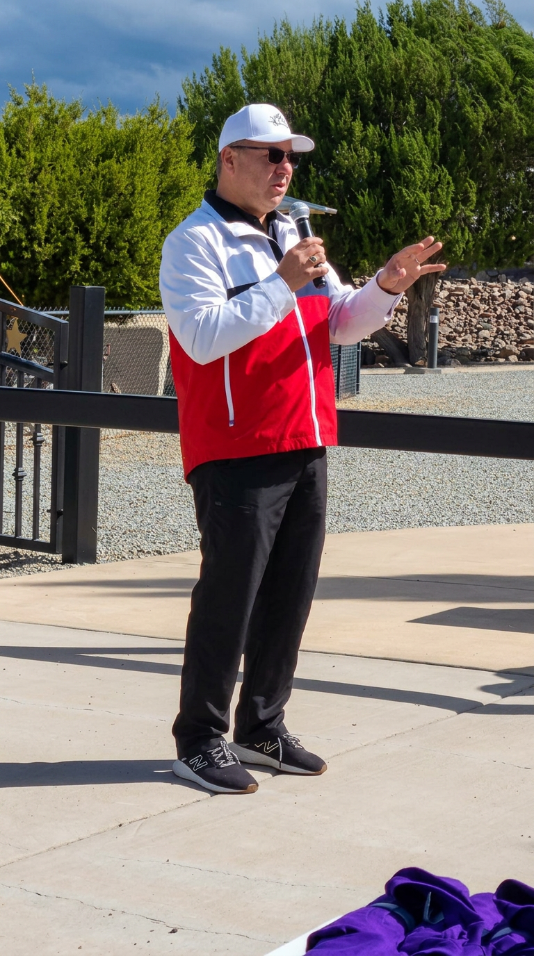 Event organizer addressing walkers with a microphone before the march